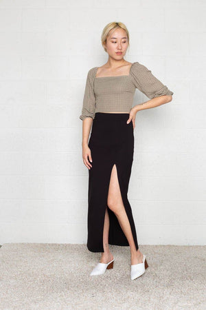 Black maxi skirt with front slit in a thick and forgiving fabrication