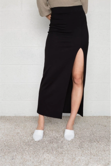 Black maxi skirt with front slit in a thick and forgiving fabrication