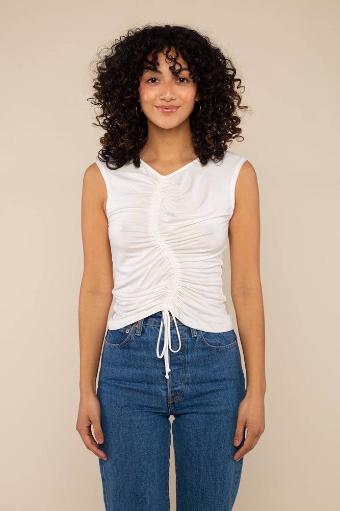 A white shirred tank with wave design through the center and adjustable string 